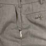 Pants with torn sides